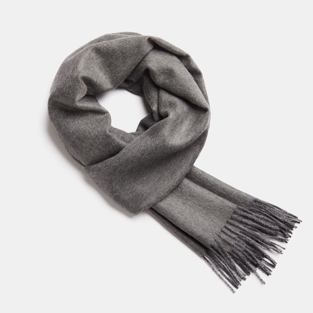 17. Studio image of Alpaka natural baby alpaca wool scarf in grey with fringe detail