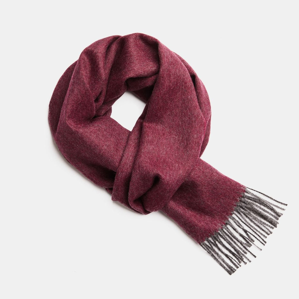 4. Studio image of Alpaka natural baby alpaca wool scarf in burgundy with fringe detail
