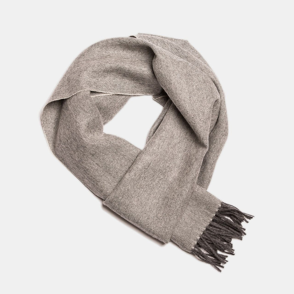 23. Studio image of Alpaka natural baby alpaca wool scarf in taupe with fringe detail