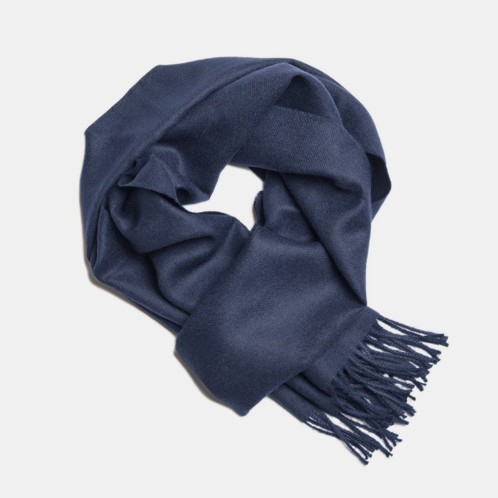 12. Navy Alpaka baby alpaca wool scarf with fringe detail in flat lay