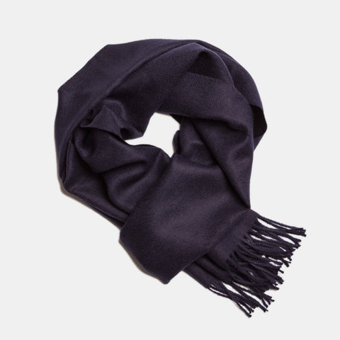 2. Navy Alpaka baby alpaca wool scarf with fringe detail in flat lay