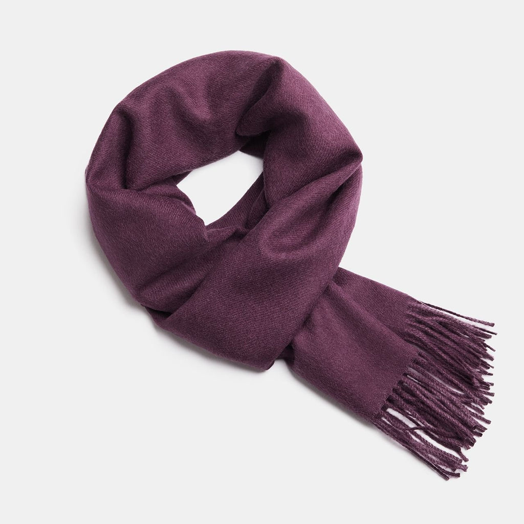 10. Purple Alpaka baby alpaca wool scarf with fringe detail in flat lay