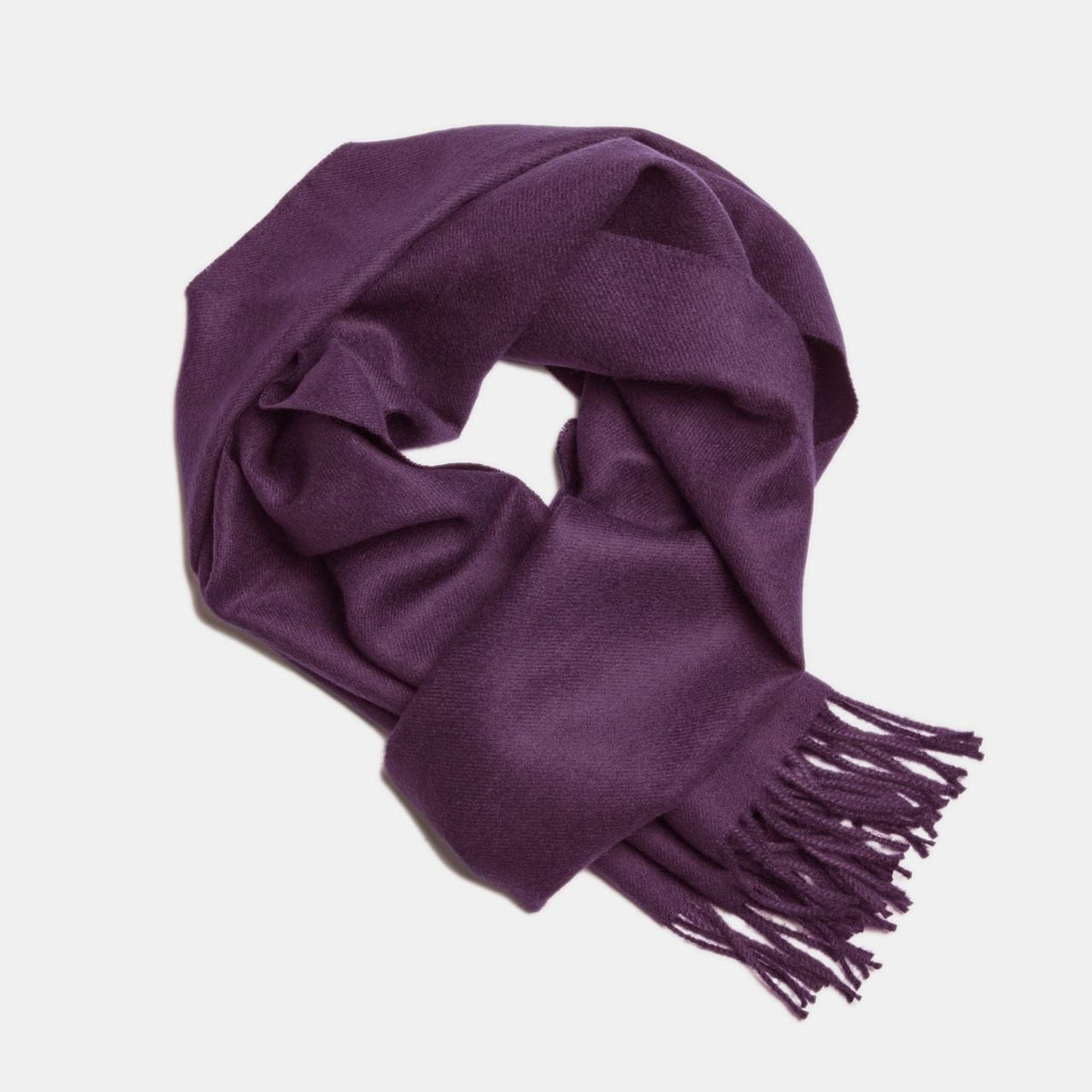 9. Purple Alpaka baby alpaca wool scarf with fringe detail in flat lay