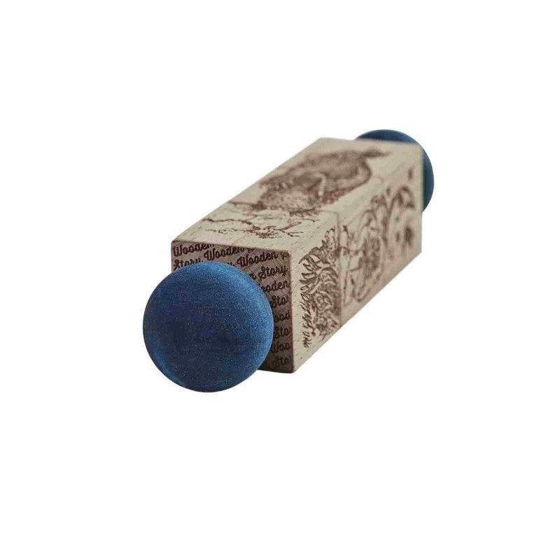 9. Close-up of wooden spinning puzzle with blue ends and engraved design