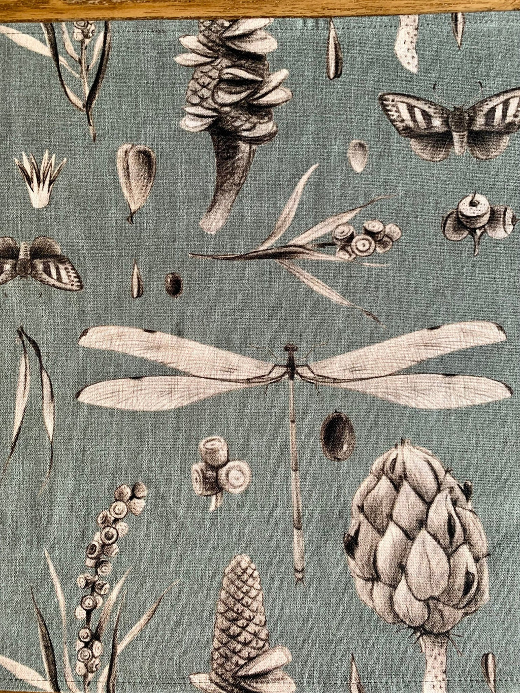 5. Detail of Seeds Aqua table runner showing dragonfly and botanical print on cotton fabric