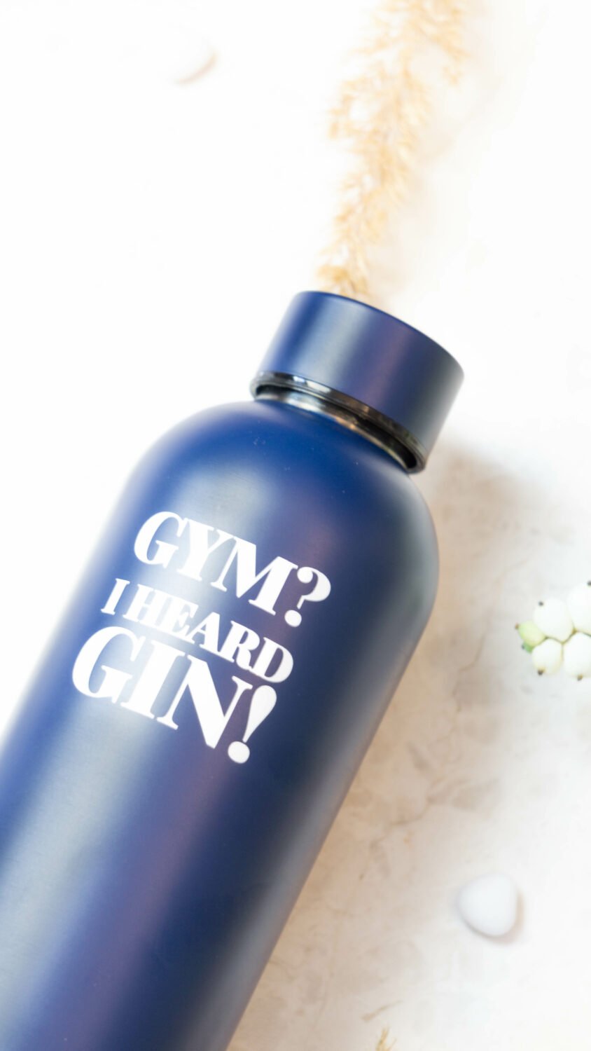 3. Close-up of SEIK dark blue water bottle showing 'Gym? I Heard Gin!' text