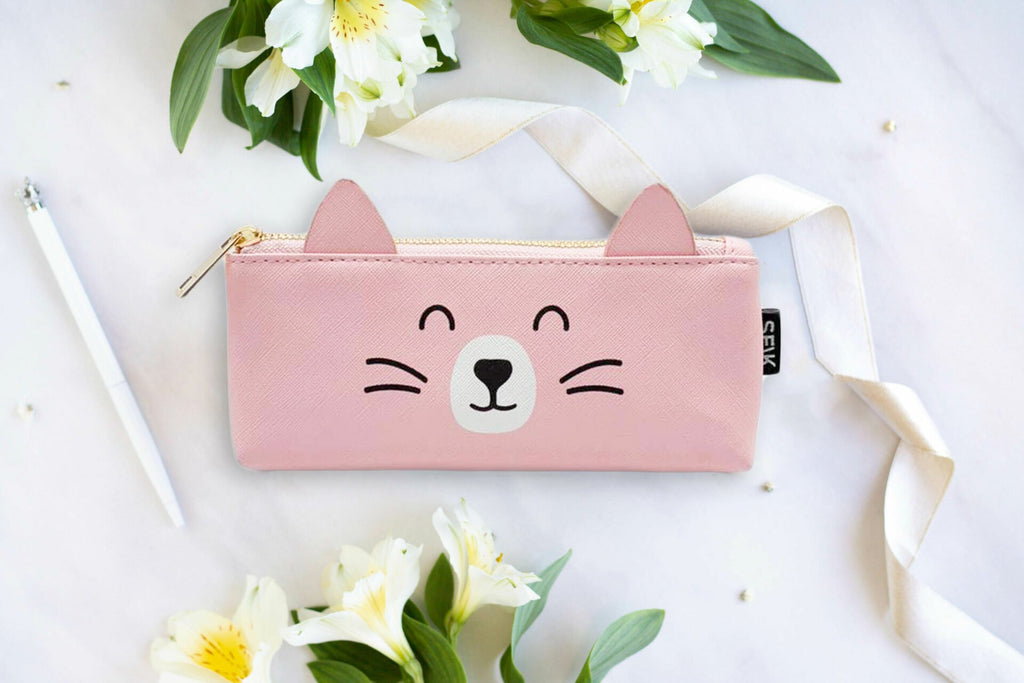 1. SEIK Happy Cat pencil case in pink faux leather with cute cat face design, surrounded by flowers and ribbon