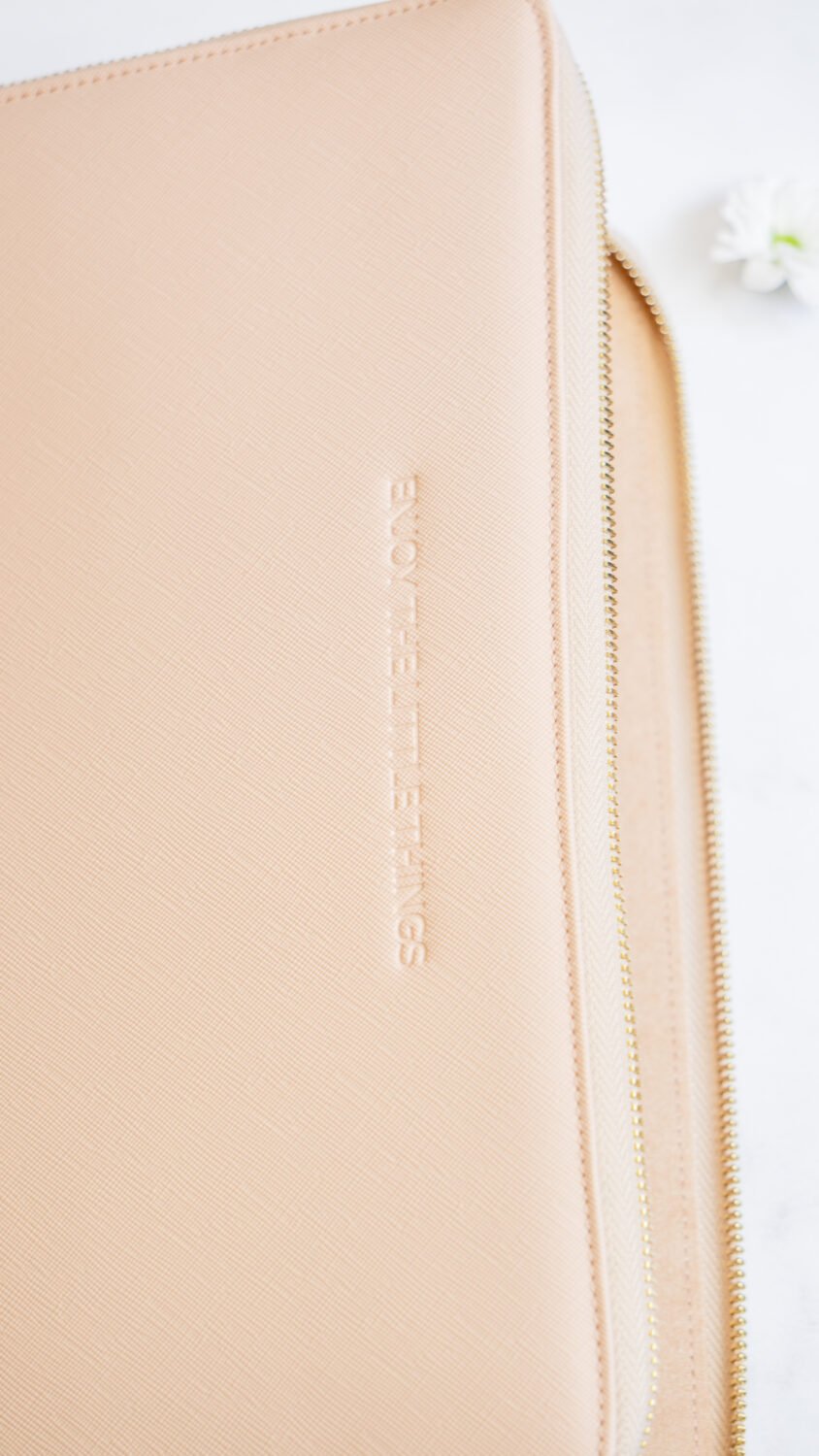 7. Close-up of SEIK pink laptop sleeve with embossed motivational message