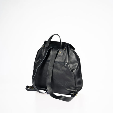 2. Back view of Papillon black leather backpack with adjustable shoulder straps, studio setting