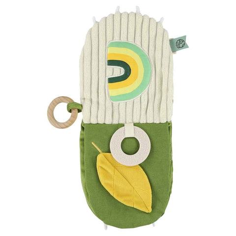 2. Open Trixie Baby Mr. Dino sensory book showing rainbow pattern, yellow leaf, and teether on green and cream fabric