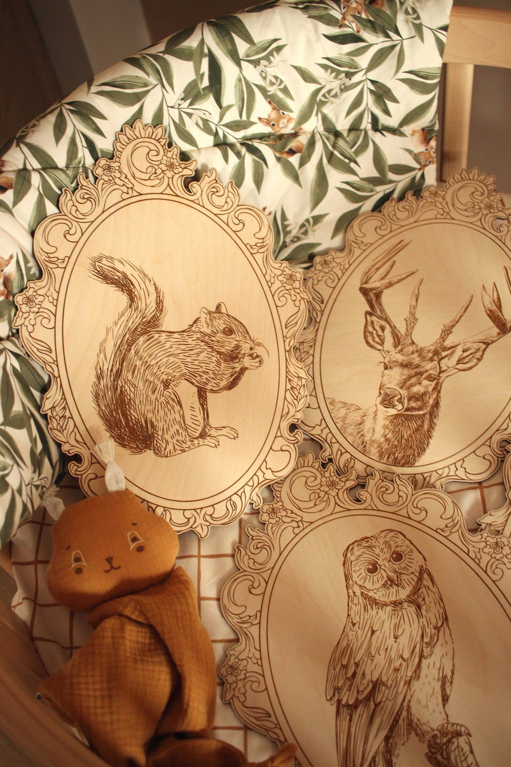 7. Set of engraved squirrel, deer, and owl pictures in retro frames on patterned fabric