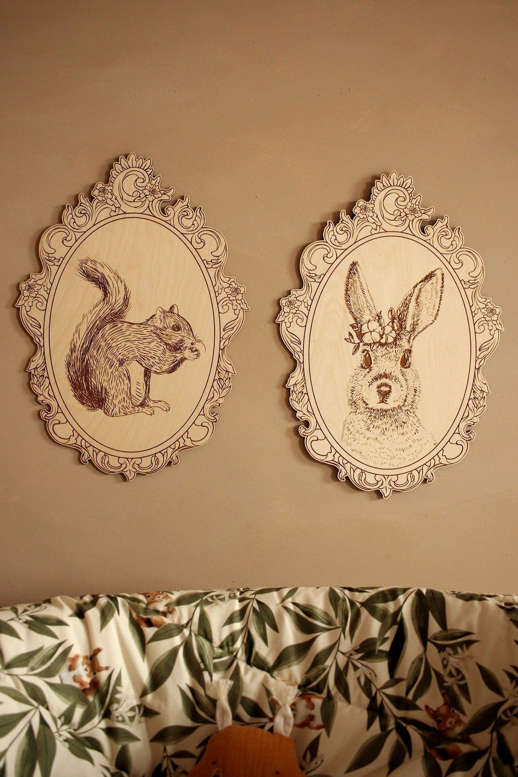 13. Engraved squirrel and rabbit pictures in retro frames on wall above floral-patterned couch
