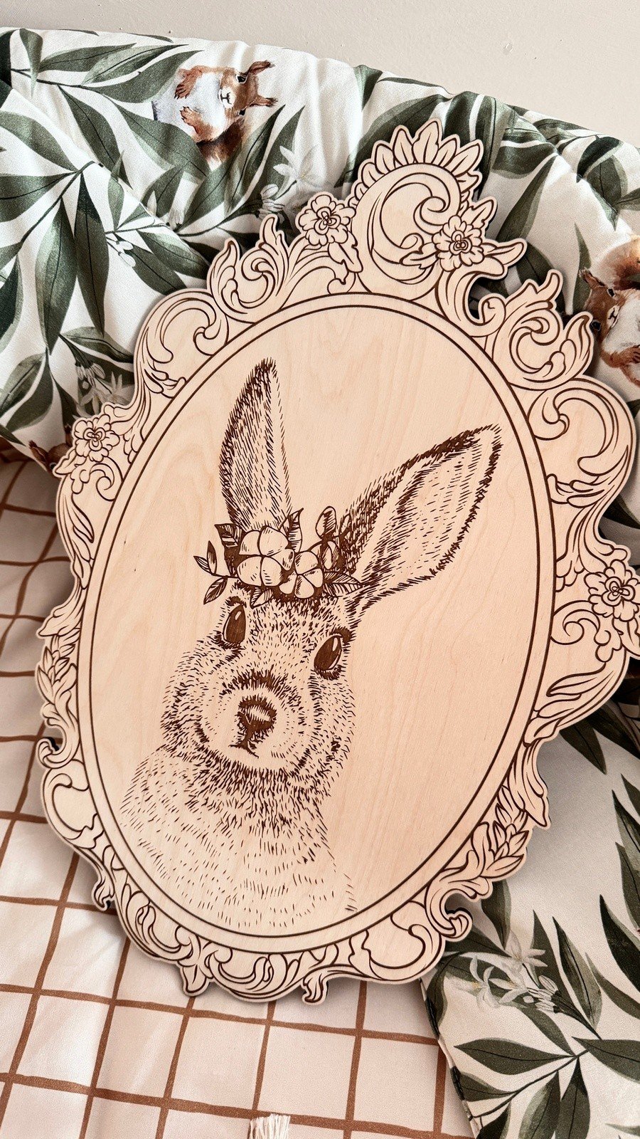 12. Engraved rabbit picture in retro frame on floral-patterned fabric