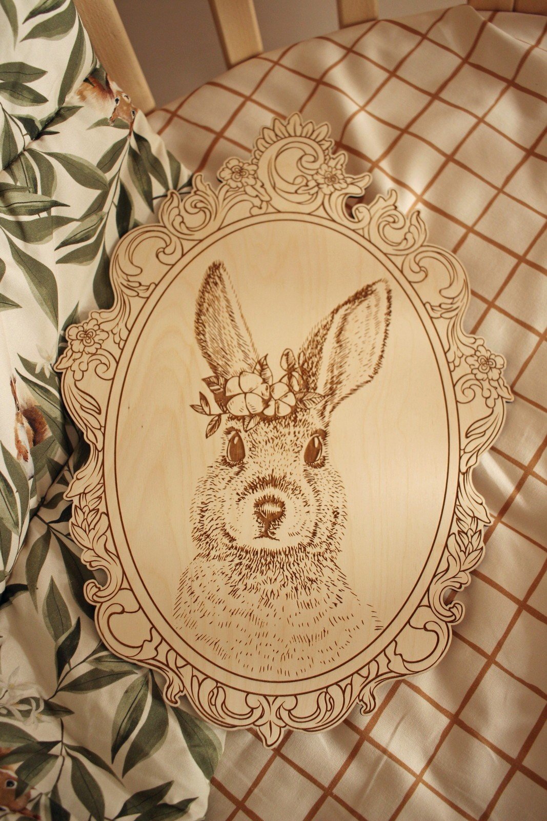 10. Engraved rabbit picture in retro frame on checkered fabric with floral pattern