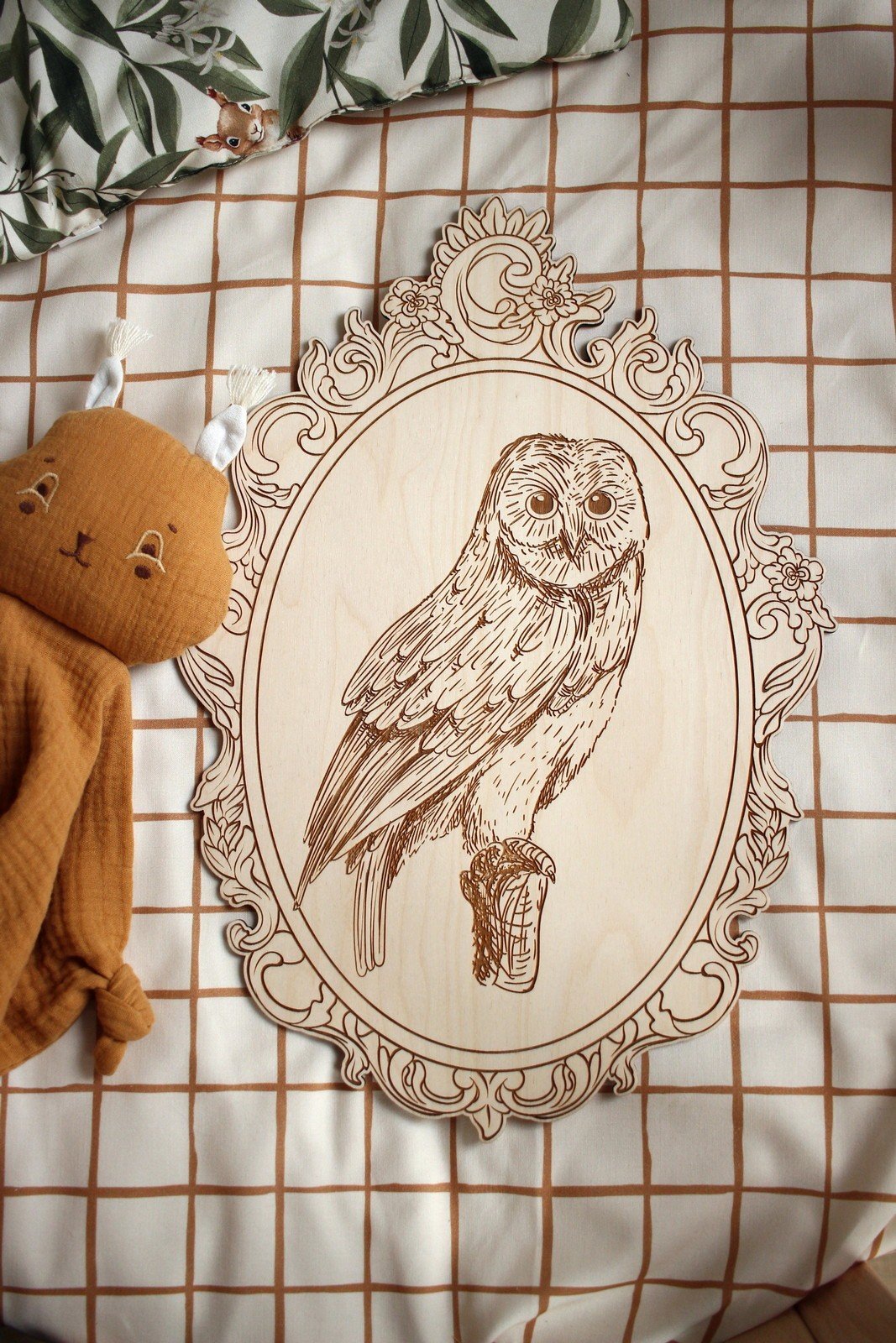5. Engraved owl picture in retro frame on checkered fabric with plush toy