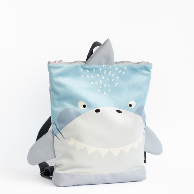 5. Muni shark backpack in studio, featuring shark face and fin details
