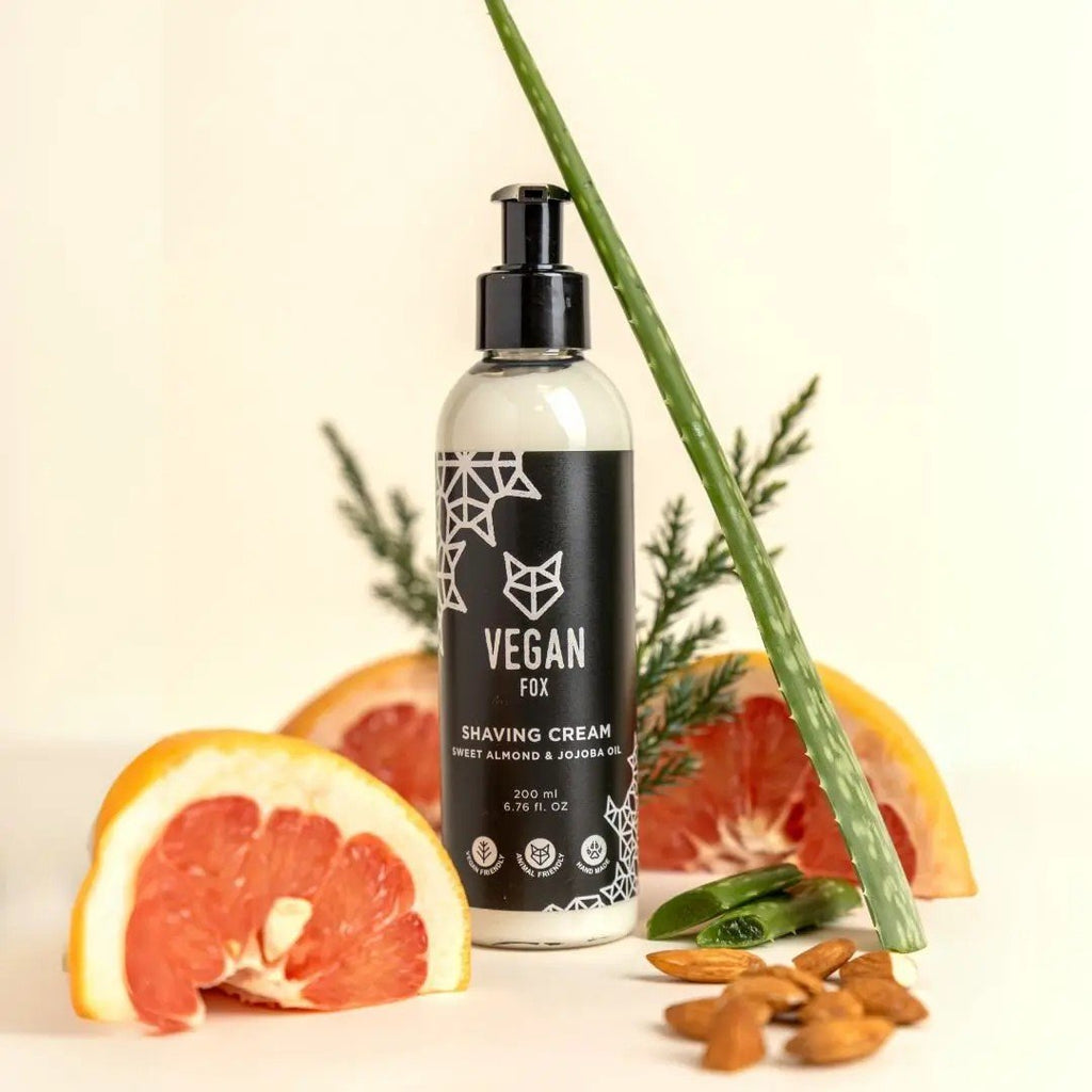 1. Vegan Fox men's shaving cream with sweet almond and jojoba oil, 200ml, surrounded by grapefruit, almonds, and aloe in a lifestyle setting