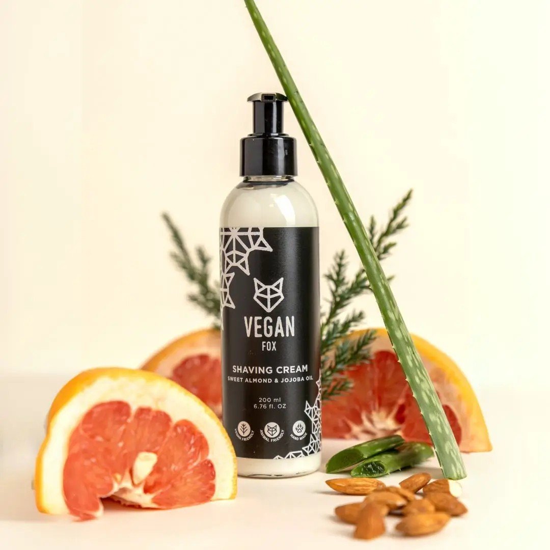 1. Vegan Fox men's shaving cream with sweet almond and jojoba oil, 200ml, surrounded by grapefruit, almonds, and aloe in a lifestyle setting