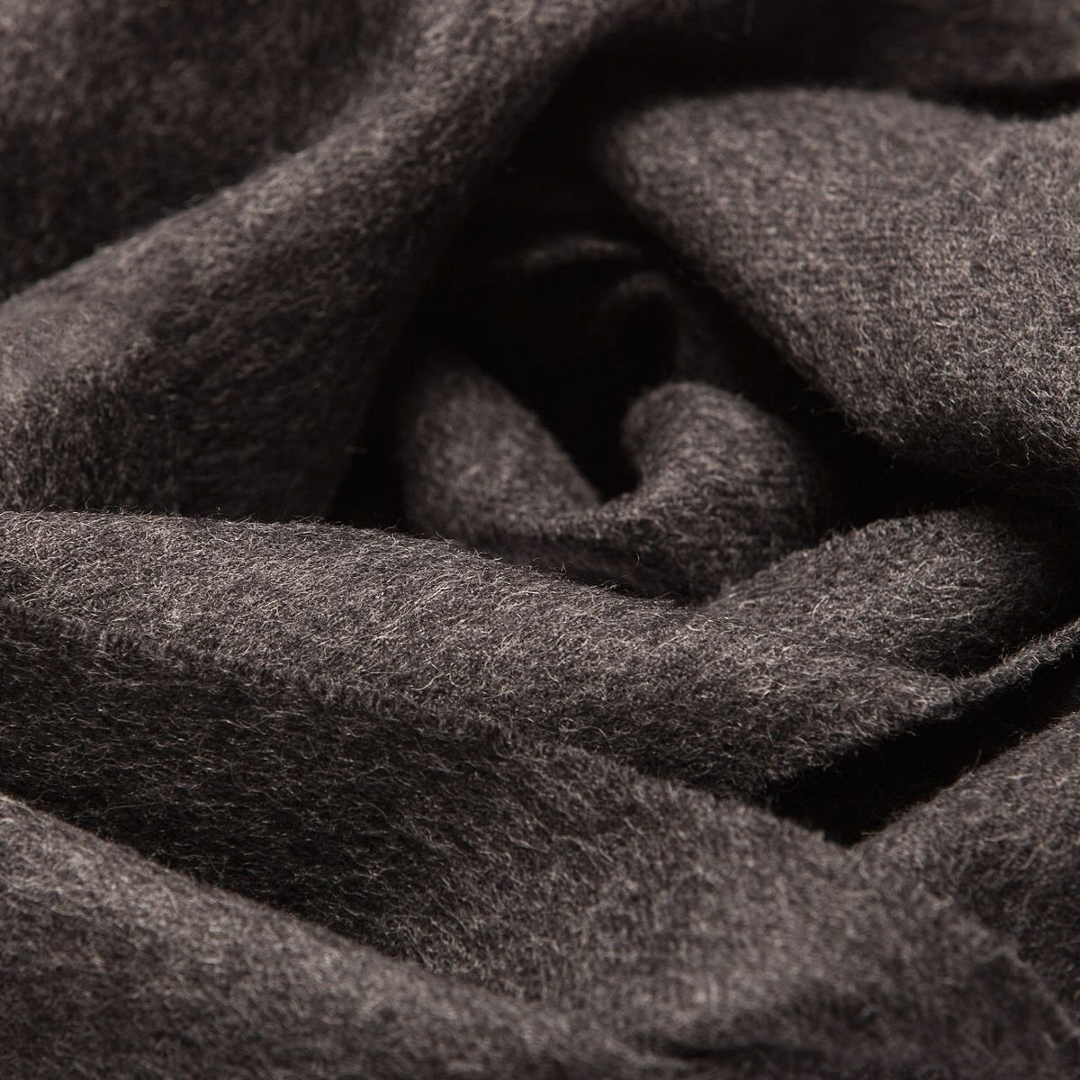 22. Close-up of Alpaka natural baby alpaca fabric in dark grey, showing texture and softness