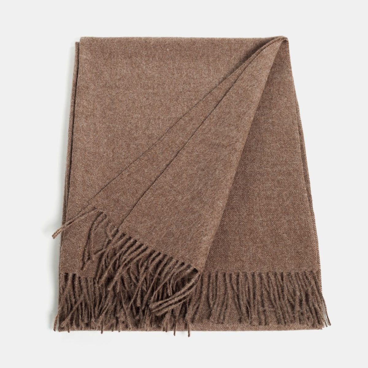 9. Flat lay of Alpaka natural baby alpaca maxi-scarf in brown with fringes, showing full length