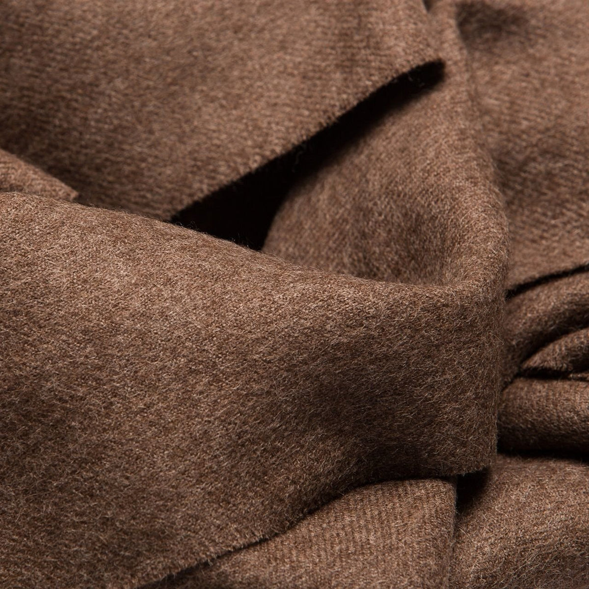 8. Close-up of Alpaka natural baby alpaca fabric in brown, showing texture and softness