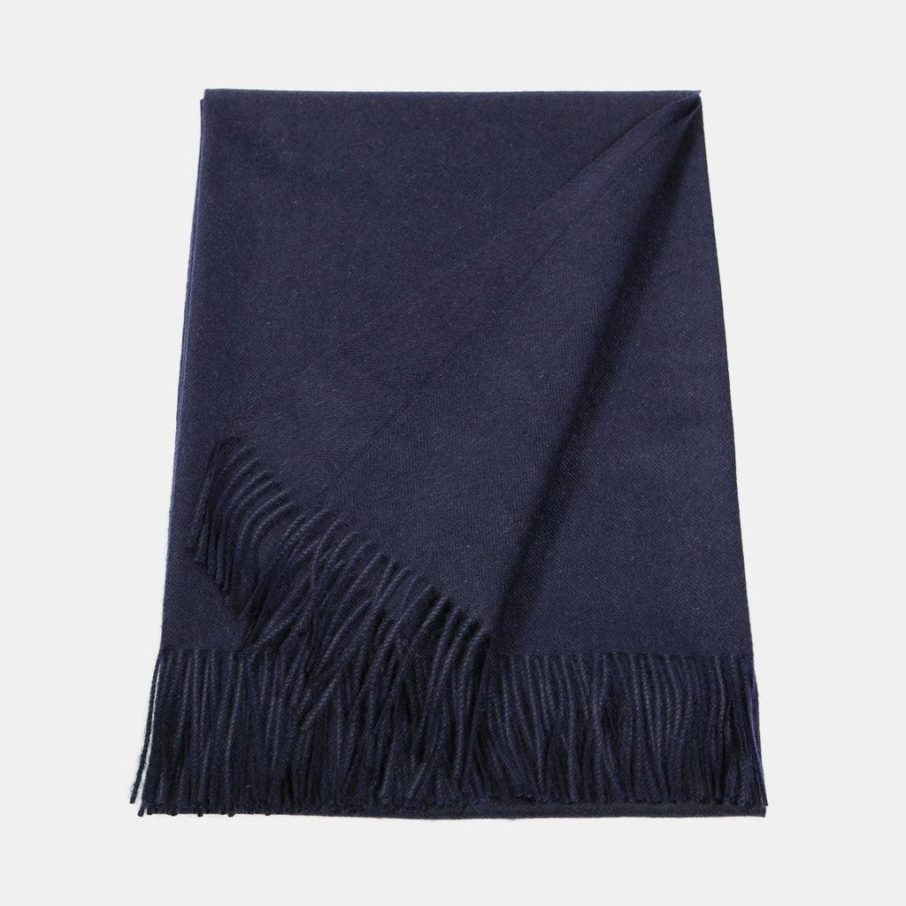 16. Flat lay of Alpaka natural baby alpaca maxi-scarf in navy with fringes, showing full length
