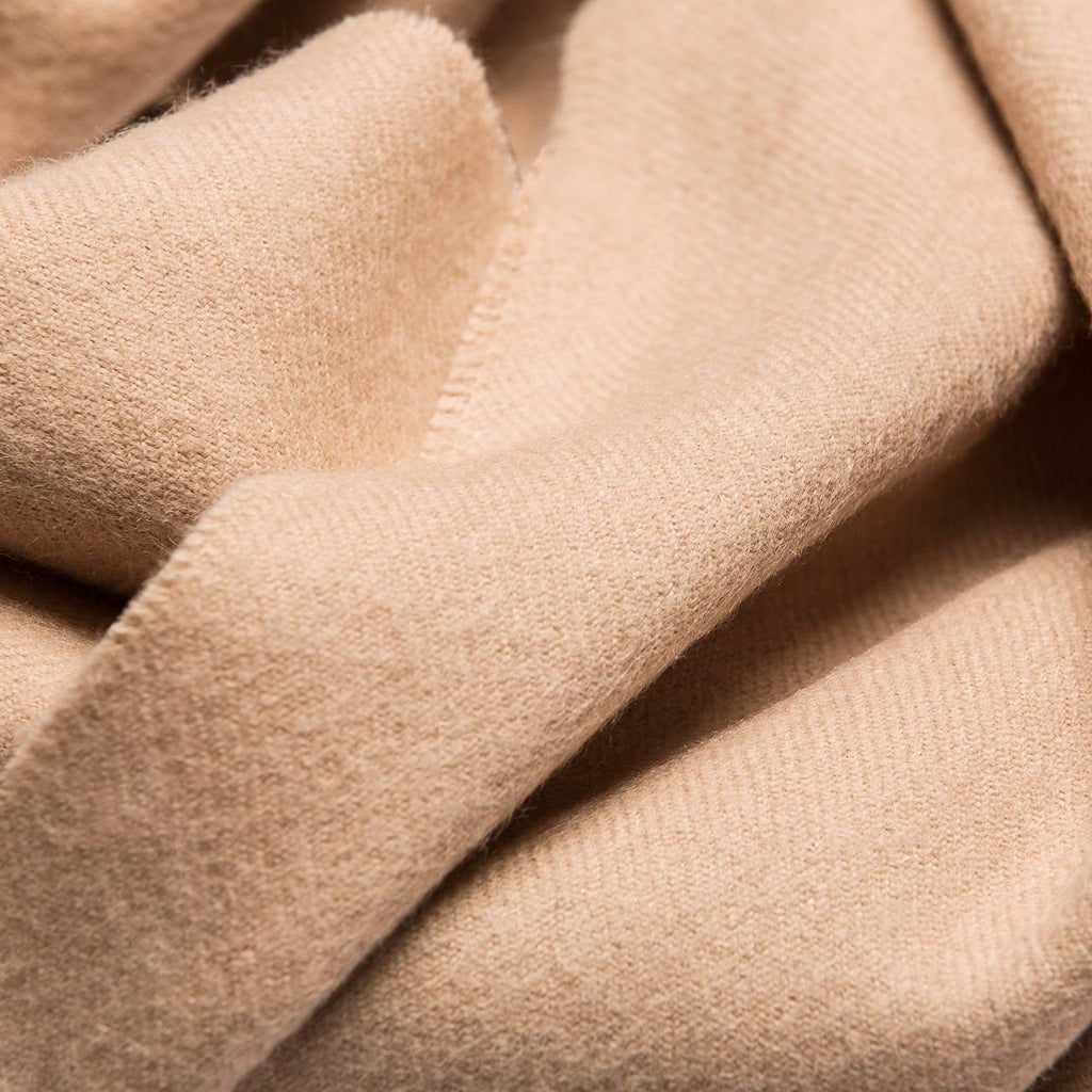 5. Close-up of Alpaka natural baby alpaca fabric in light beige, showing texture and softness