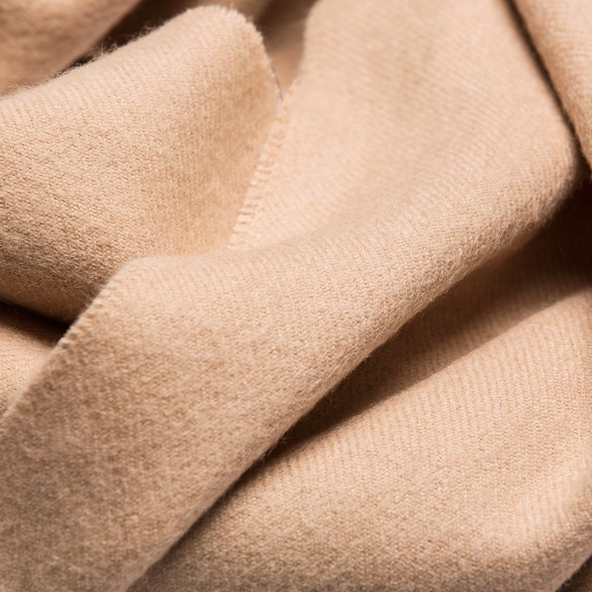 5. Close-up of Alpaka natural baby alpaca fabric in light beige, showing texture and softness