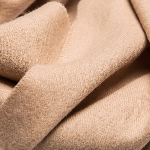 5. Close-up of Alpaka natural baby alpaca fabric in light beige, showing texture and softness
