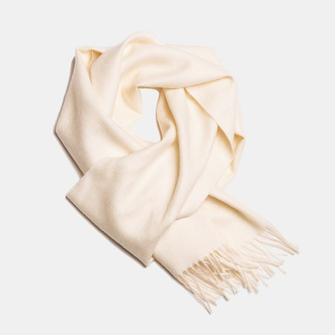 4. White Alpaka baby alpaca wool scarf with fringe detail in flat lay