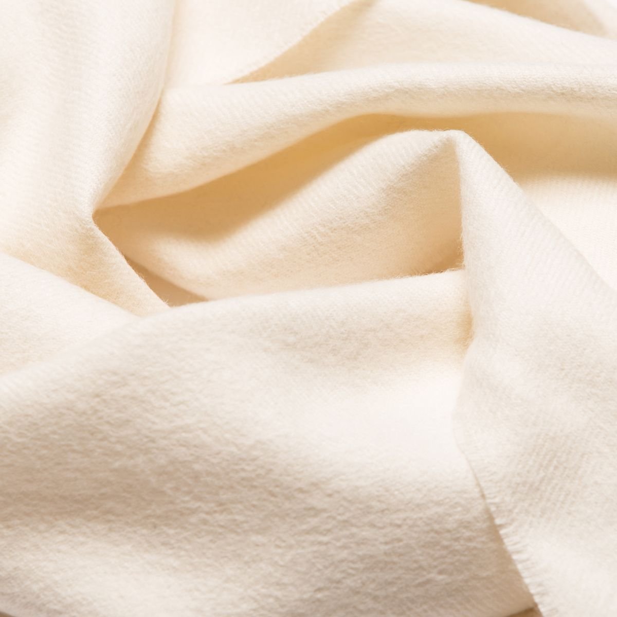 11. Close-up of Alpaka natural baby alpaca fabric in cream, showing texture and softness