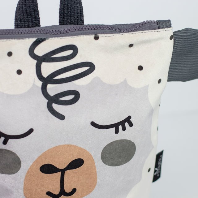 9. Close-up of Muni sheep backpack design, focusing on the sheep face and fabric texture