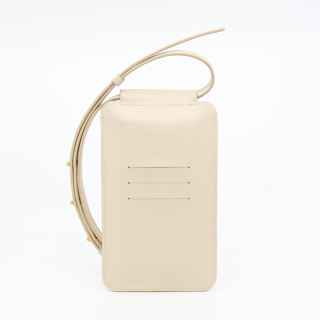 2. Studio shot of Tairi Roosve beige leather phone bag with credit card slots and adjustable strap