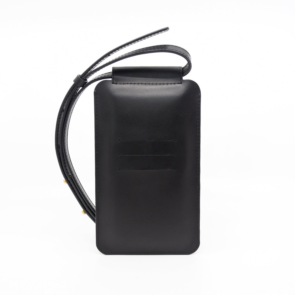 3. Studio image of Tairi Roosve black leather phone bag with adjustable strap and card slots