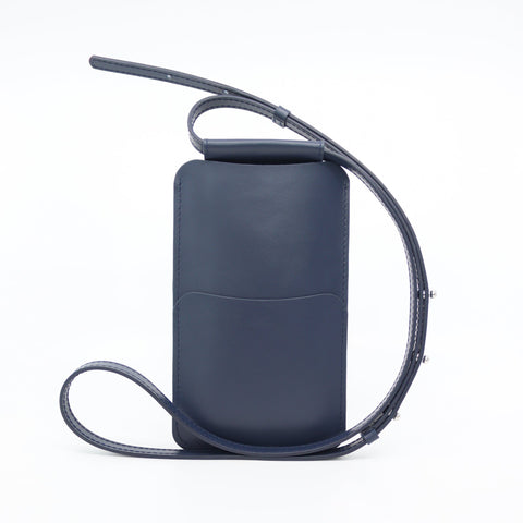 5. Back view of Tairi Roosve navy leather phone bag with adjustable strap and card slots
