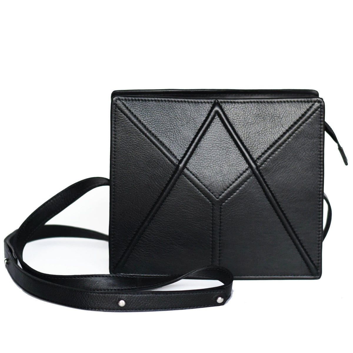 16. Black FACET shoulder bag by Gerda Retter Design, displayed with a removable strap in a studio setting