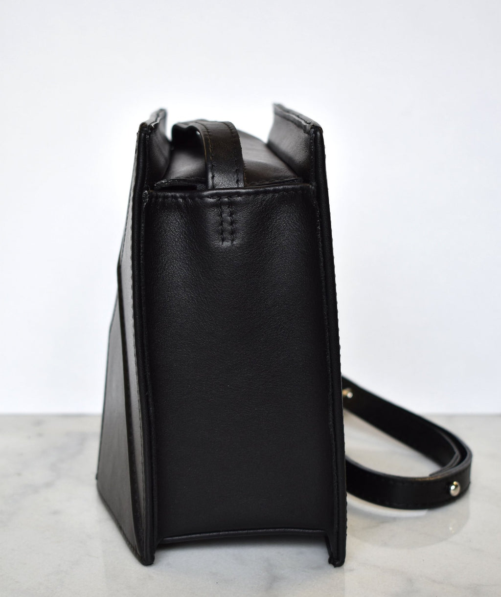 14. Side view of black FACET shoulder bag by Gerda Retter Design, highlighting the leather texture