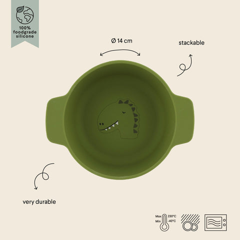 3. Green silicone bowl with dinosaur design, labeled as stackable and durable, with temperature icons