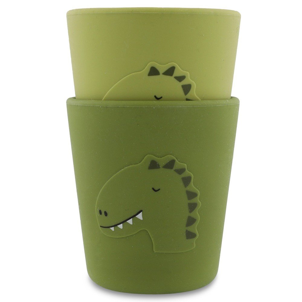2. Two green silicone cups with dinosaur design, stackable, on white background