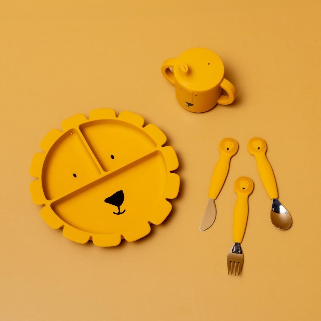 1. Yellow lion-shaped silicone plate with matching cup and utensils on a yellow background