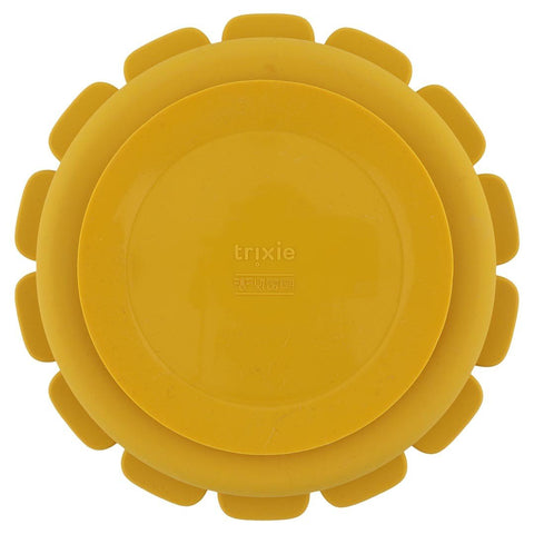 3. Back view of yellow lion-shaped silicone plate showing suction feature and Trixie logo