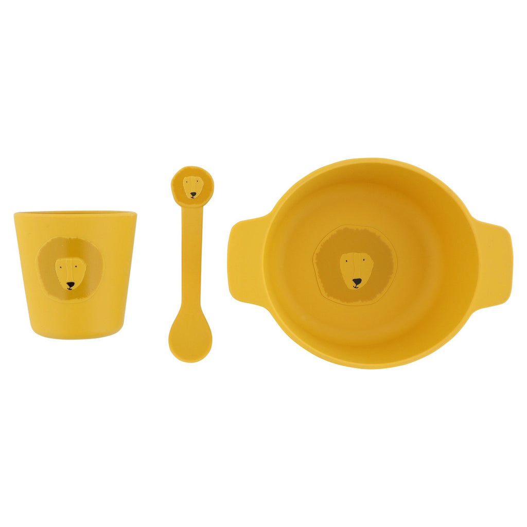 3. Trixie Baby Mr. Lion silicone meal set with yellow cup, spoon, and bowl featuring lion face design, on white background