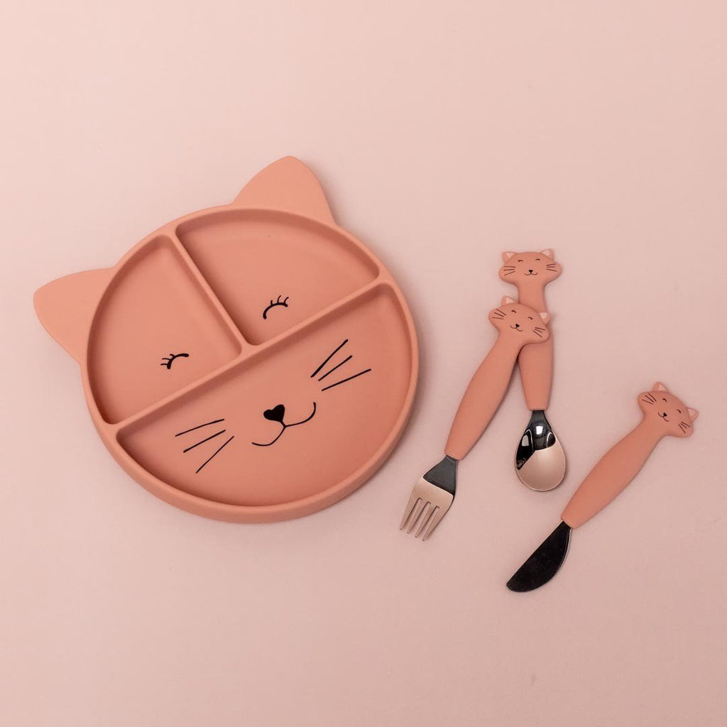 2. Trixie Baby Mrs. Cat silicone plate with matching cat-themed fork and spoon set on peach background