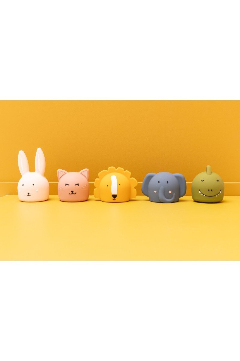 7. Collection of Trixie Baby silicone night lights including Mr. Lion, displayed on a yellow background