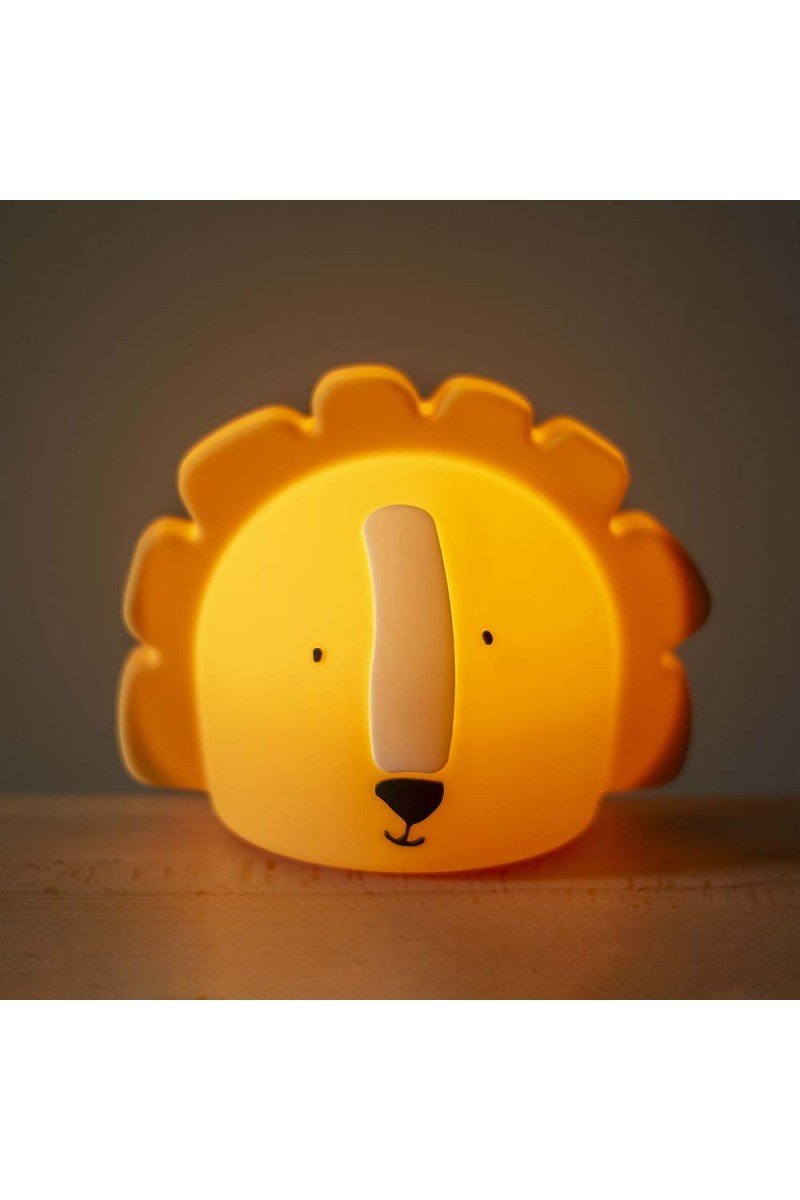 4. Trixie Baby's Mr. Lion silicone night light glowing warmly in a dimly lit room