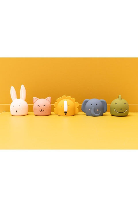 4. Group of Trixie Baby silicone night lights including Mr. Elephant, rabbit, cat, lion, and dinosaur on yellow background