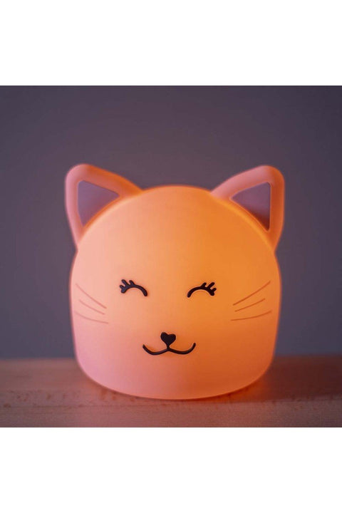 3. Close-up of Trixie Baby's Mrs. Cat silicone night light glowing in dim lighting