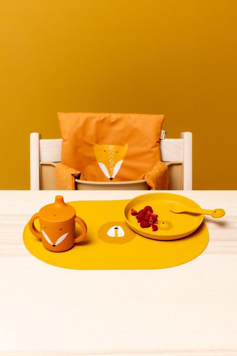 3. Mr. Fox silicone sippy cup on table with matching plate and spoon, high chair in background
