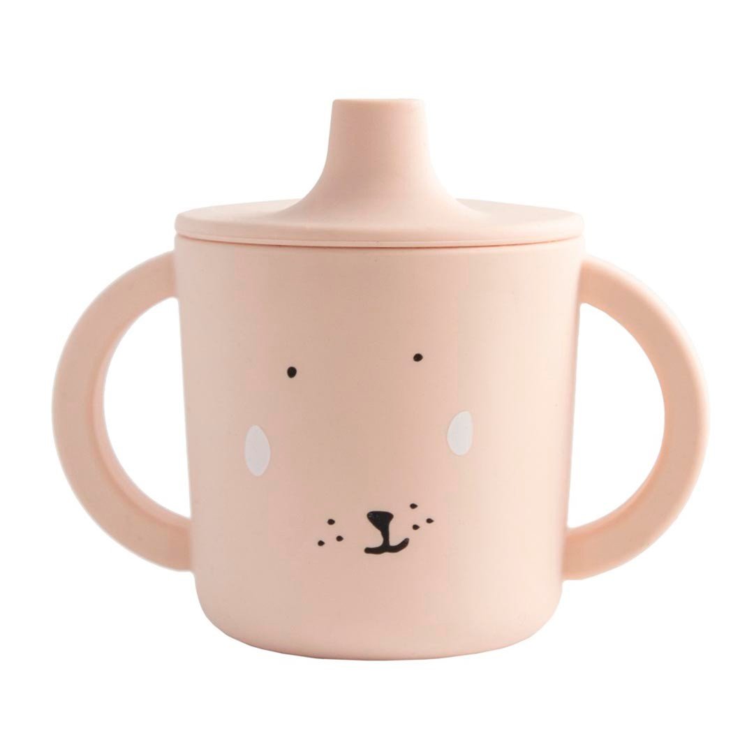 2. Pink silicone sippy cup with rabbit face design and large handles on white background