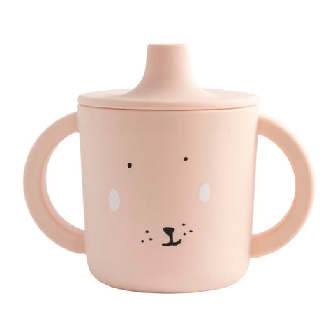 2. Pink silicone sippy cup with rabbit face design and large handles on white background